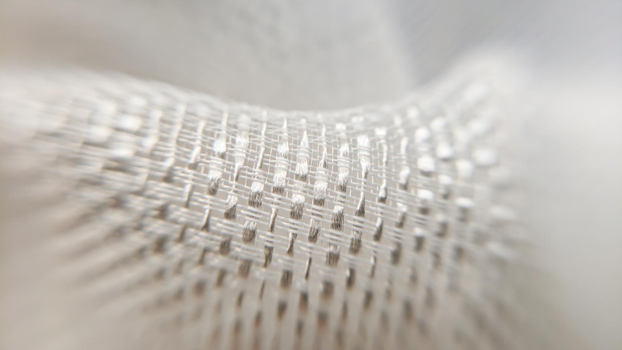 close-up of modern embroidered geometric stitch on linen